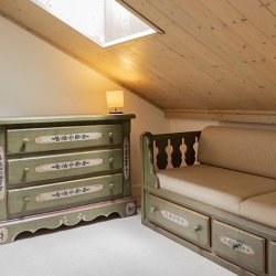 The seating area in one of the double bedrooms in Apartment Dou du Pont in Meribel Centre