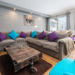 Lovely Living area with fireplace in Chalet Le Christope in Meribel Village