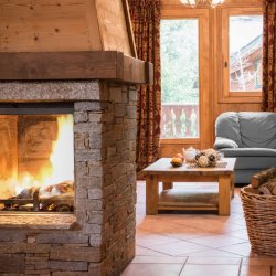 The Fireplace and Living area in Chalet Topaz in La Tania