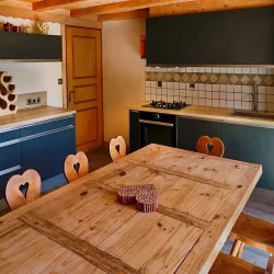 The Kitchen and dining area in Chalet La Combe in Meribel