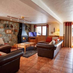 The Living area with fireplace in Chalet Daurel, Meribel Centre