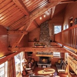 The Living area with fireplace in Chalet La Renarde, Meribel