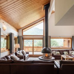 The comfortable Living room with Stove in Chalet Virage Meribel