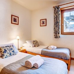 A Twin bedroom in Chalet Veronica Meribel