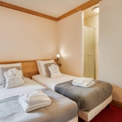 One of the Twin bedrooms in Catered Chalet Petit Sabot in Val Thorens
