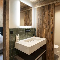 An ensuite bedroom in Penthouse Chalet Apartment Le Cygne in Meribel Centre
