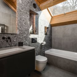 A bathroom in Chalet Infusion Meribel Village