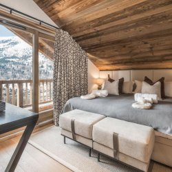 One of the spacious bedrooms in Chalet Infusion Meribel Village