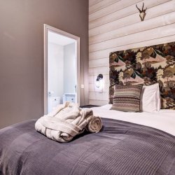 A double bedroom in Chalet Quatre Meules Meribel