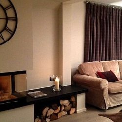 The living room and fireplace in Chalet Montana Meribel Centre