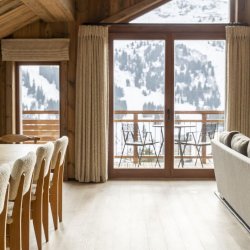 The dining and living areas in Chalet Apartment Le Cygne Meribel Centre
