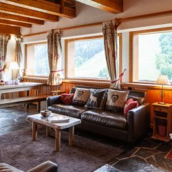 The Living room and dining area in Chalet La Fugue in Meribel