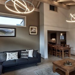 Living room and dining area.in Chalet Le Bouquetin in Meribel