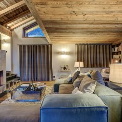 The Living room with fireplace in Chalet Bergeronnette Meribel Nantgerel