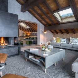 The living room and fireplace in Chalet Serendipity Meribel Village