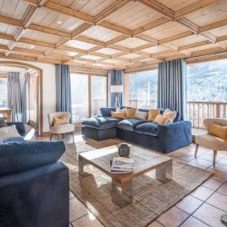 The beautiful spacious living room with fireplace in Chalet Iamato Meribel Village