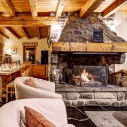 The living room and dining area in Chalet Cecilia in Meribel