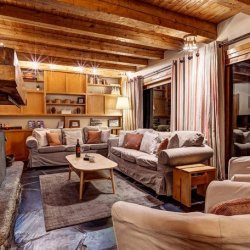 The living room and fireplace in Chalet Cecilia Meribel