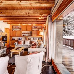 The living room and large terrace in Chalet Cecilia Meribel