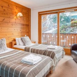 A Twin bedroom in Chalet Natalette II Meribel Mottaret