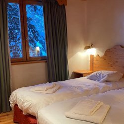 A bedroom in Chalet Mira Belum Meribel