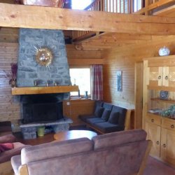 Comfortable living room with fireplace in Chalet La Renarde