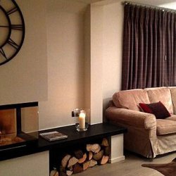 Cosy living room and fireplace in Chalet Montee Meribel