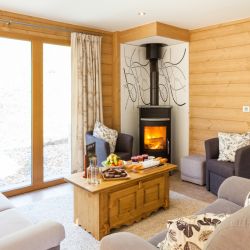 The living area with stove in Chalet Les Sauges Meribel Les Allues