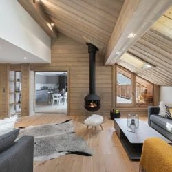 The comdotable Living room with a fireplace in Apartment Le Glaciers 12 Meribel