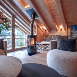 The Living area with Stove in Chalet Harmony Meribel