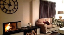 The living room and fireplace in Chalet Montana Meribel Centre